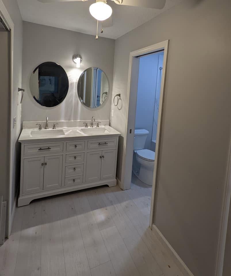 Completed bathroom remodeling project with double vanity